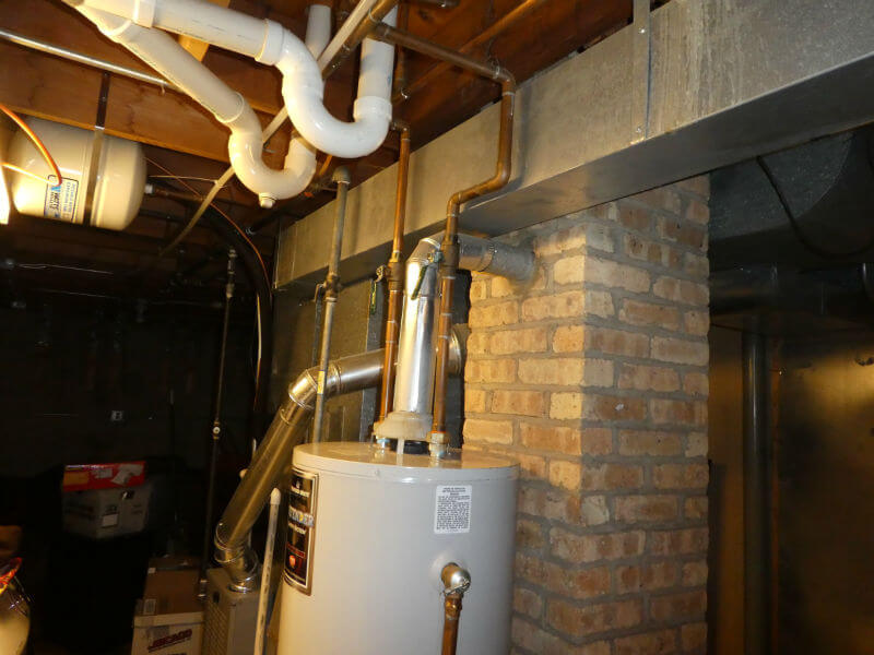 Photo of the pipes connecting the furnace and or water heater to the chimney.