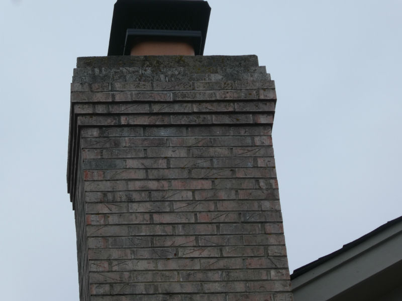 Photo taken from ground level and zoomed in to view the top of your chimney.