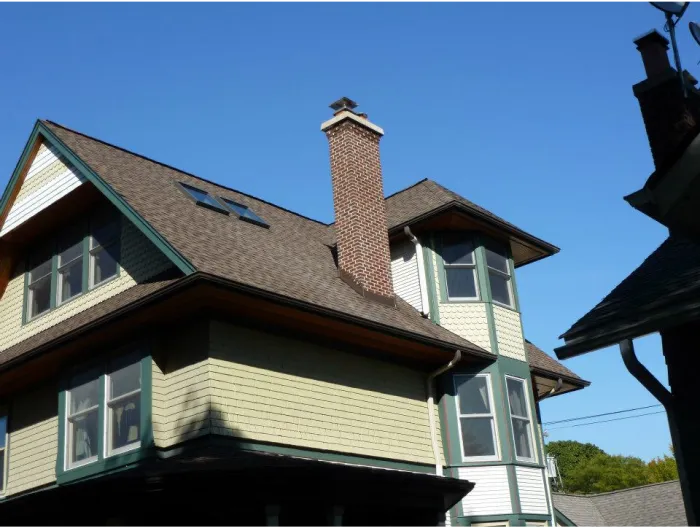 Original Photo- chimney-Leonard & Sons Chimney Red brick chimney on a light green house